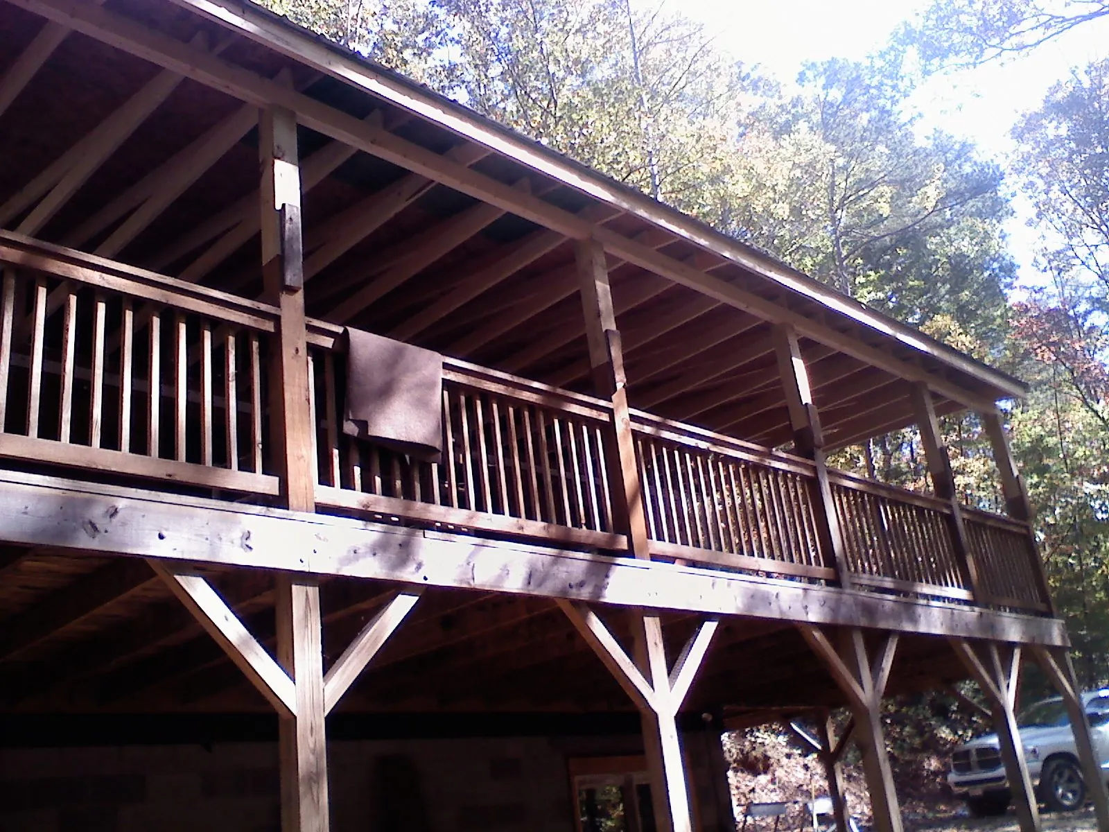 Timber framing under a new elevated porch and deck — Roof Leak Repair in Beech Creek by Roofing Brothers